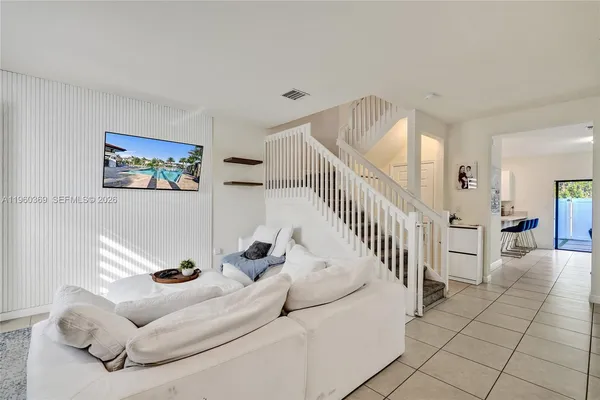 a view of a bedroom with furniture and staircase
