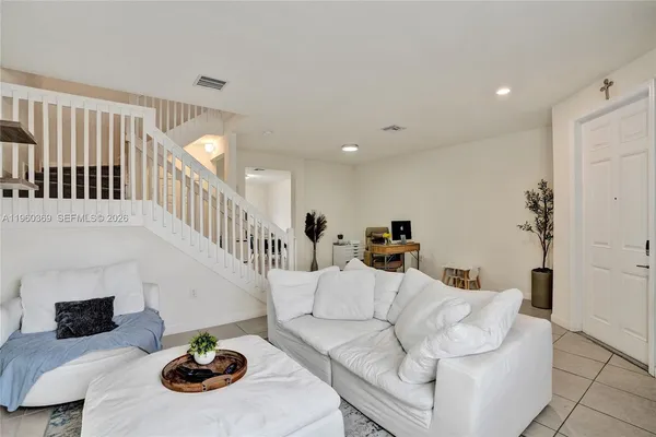 a living room with furniture and a table