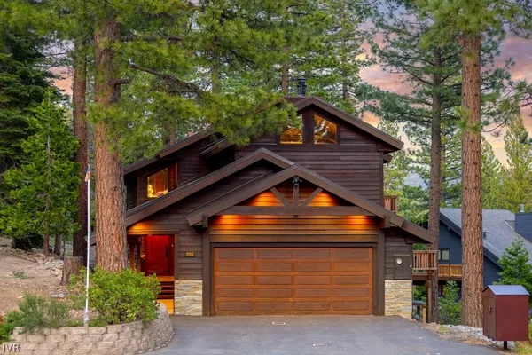 a front view of a house with a garage