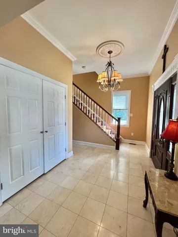a view of a livingroom with furniture and staircase