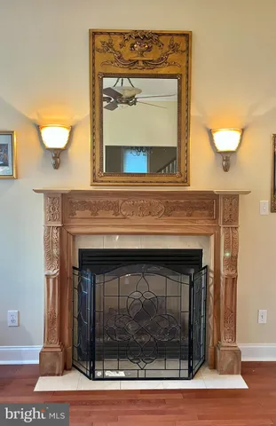 a living room with a fireplace and a fireplace