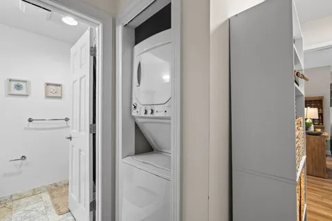 a view of a hallway with a washer and dryer