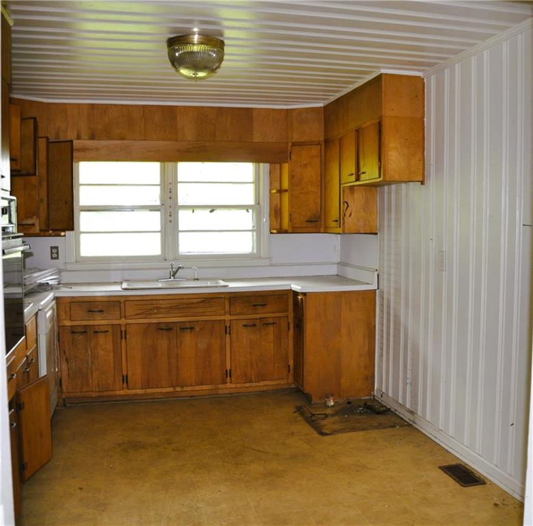 590 Villa Rica Highway Dallas, GA 30157 - Photo 8 of 17 a kitchen with a sink and a window