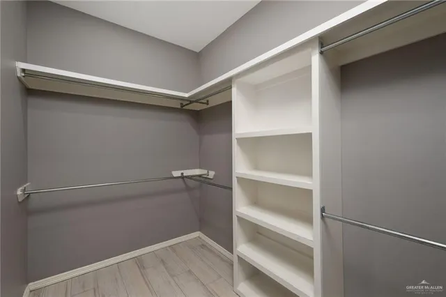 a view of an empty walk in closet