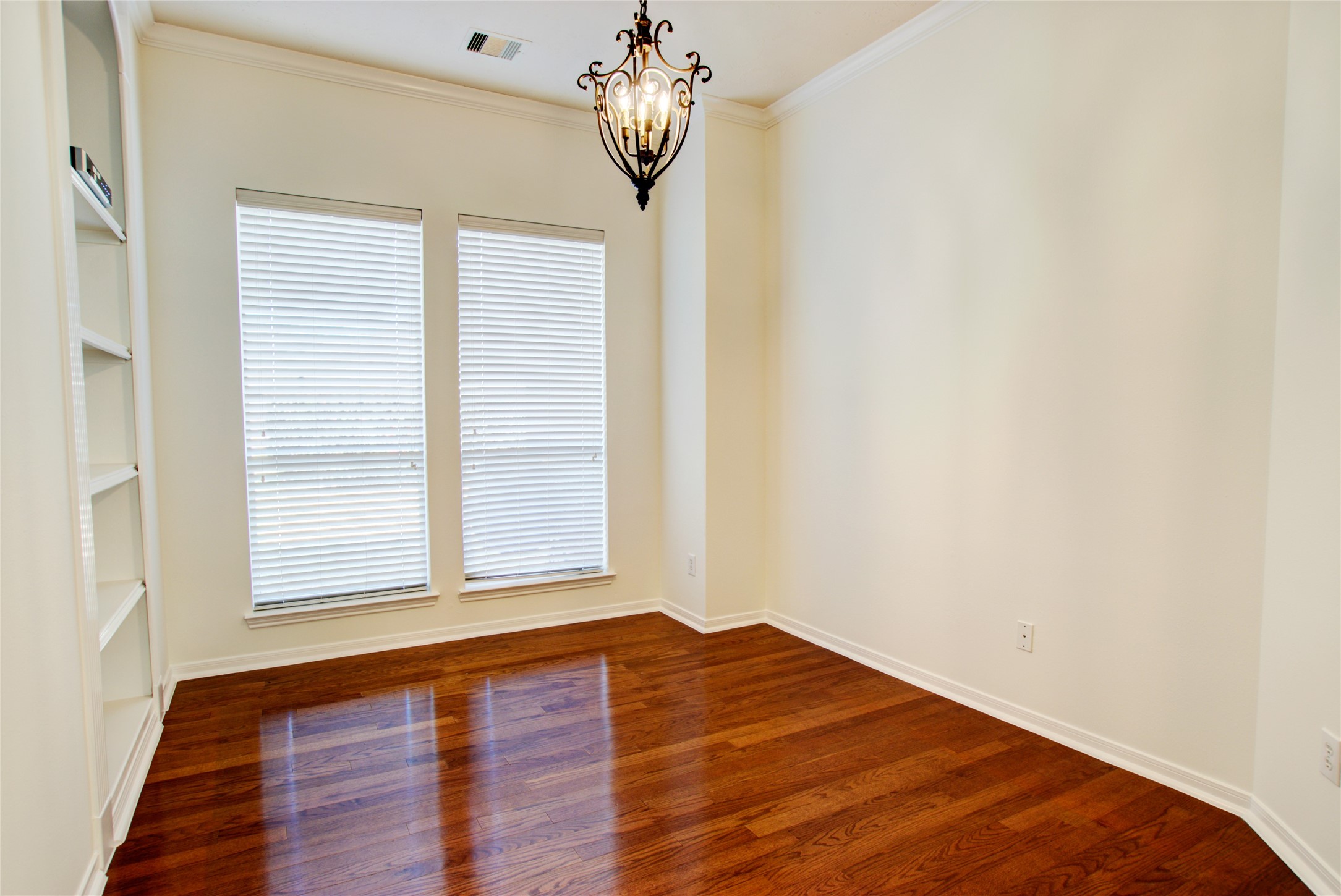 3327 River Bend Drive Rosenberg, TX 77471 - Photo 15 of 33 a view of a room with wooden floor and chandelier