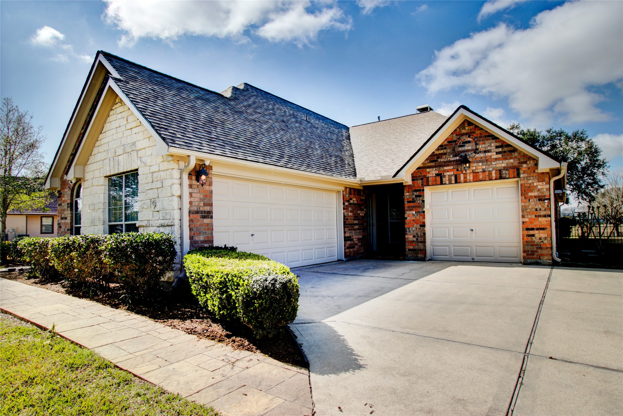 3327 River Bend Drive Rosenberg, TX 77471 - Photo 32 of 33 a front view of a house with a yard and garage