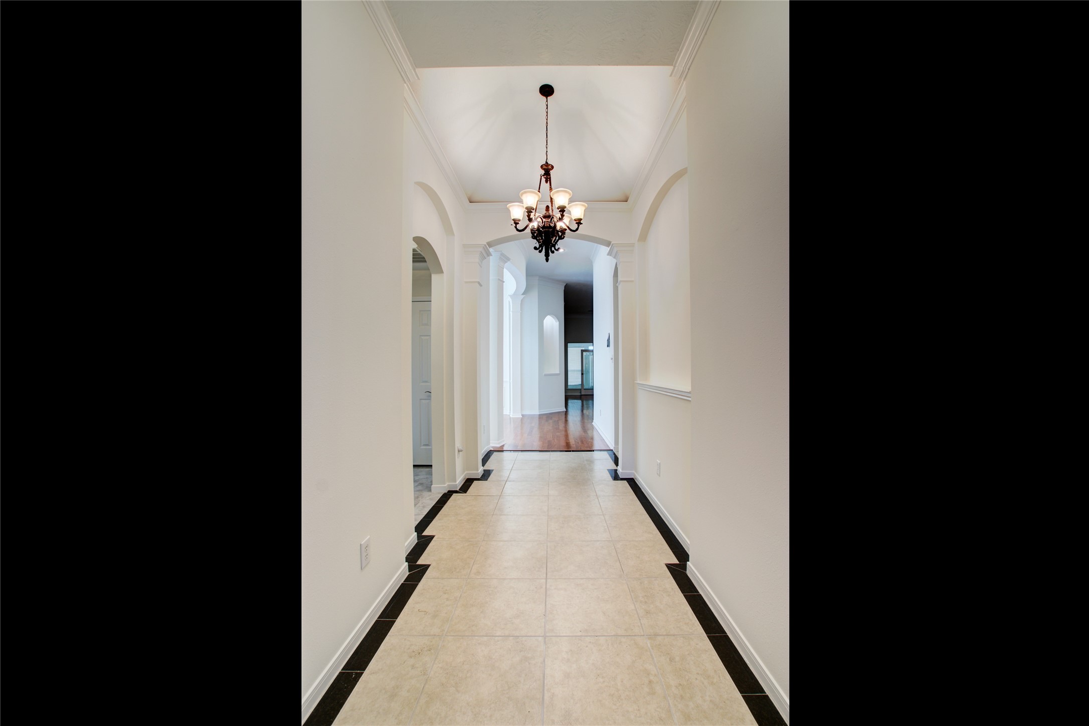 3327 River Bend Drive Rosenberg, TX 77471 - Photo 5 of 33 a view of a hallway view with chandelier