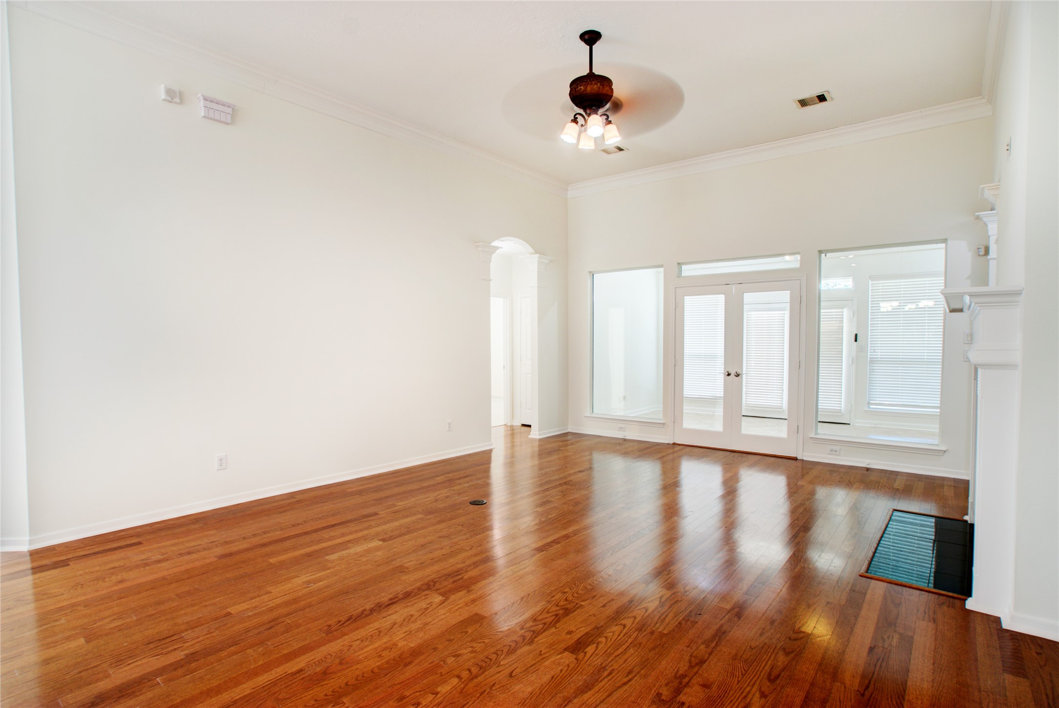 3327 River Bend Drive Rosenberg, TX 77471 - Photo 10 of 33 a view of an empty room with wooden floor and a window