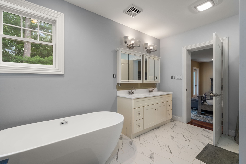 24 Wayside Inn Road Framingham, MA 01701 - Photo 34 of 38 a spacious bathroom with a tub sink shower and mirror