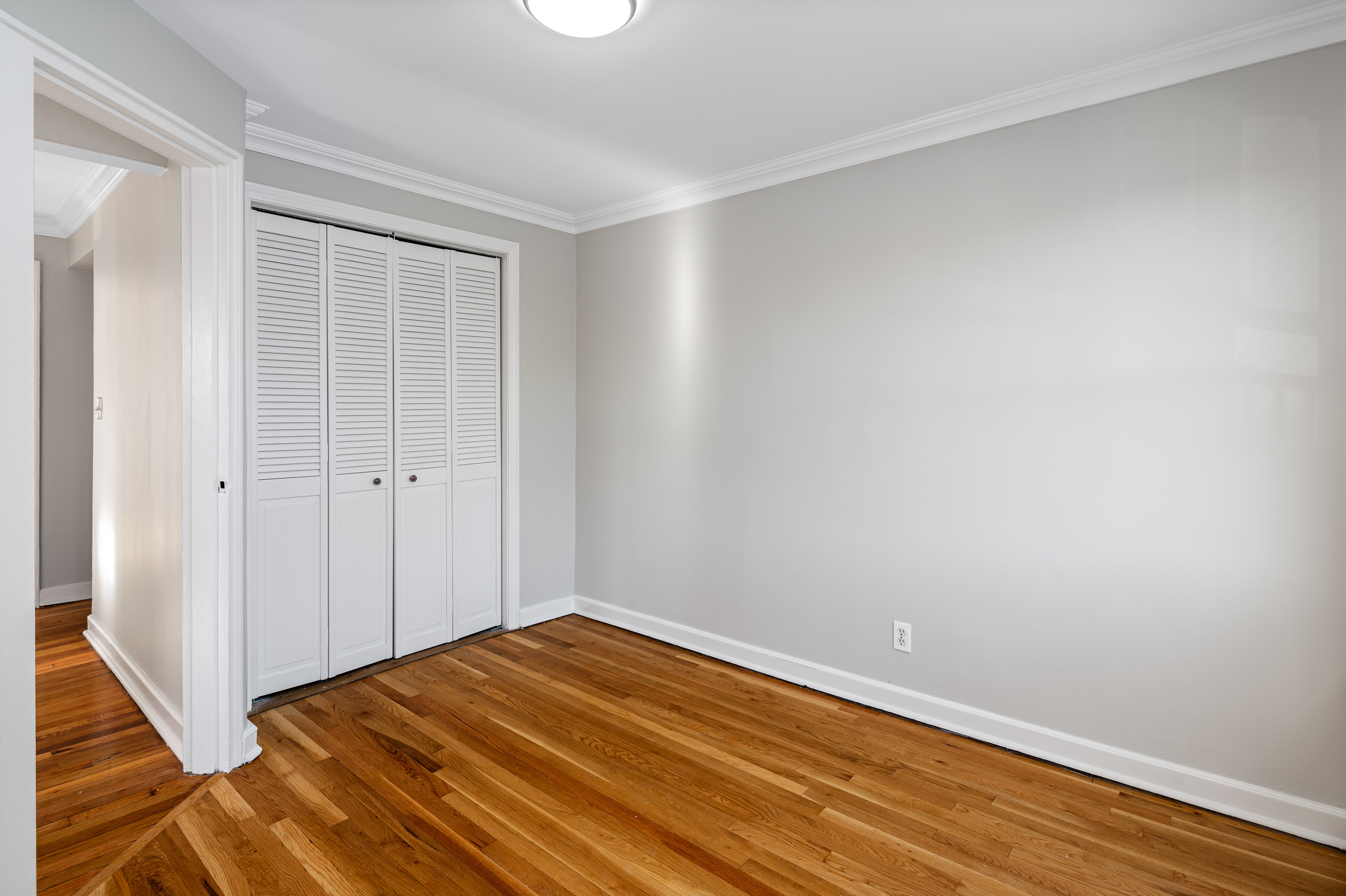 23 Standish Road, Unit 2 Stamford, CT 06902 - Photo 15 of 27 a view of a room with wooden floor and white walls