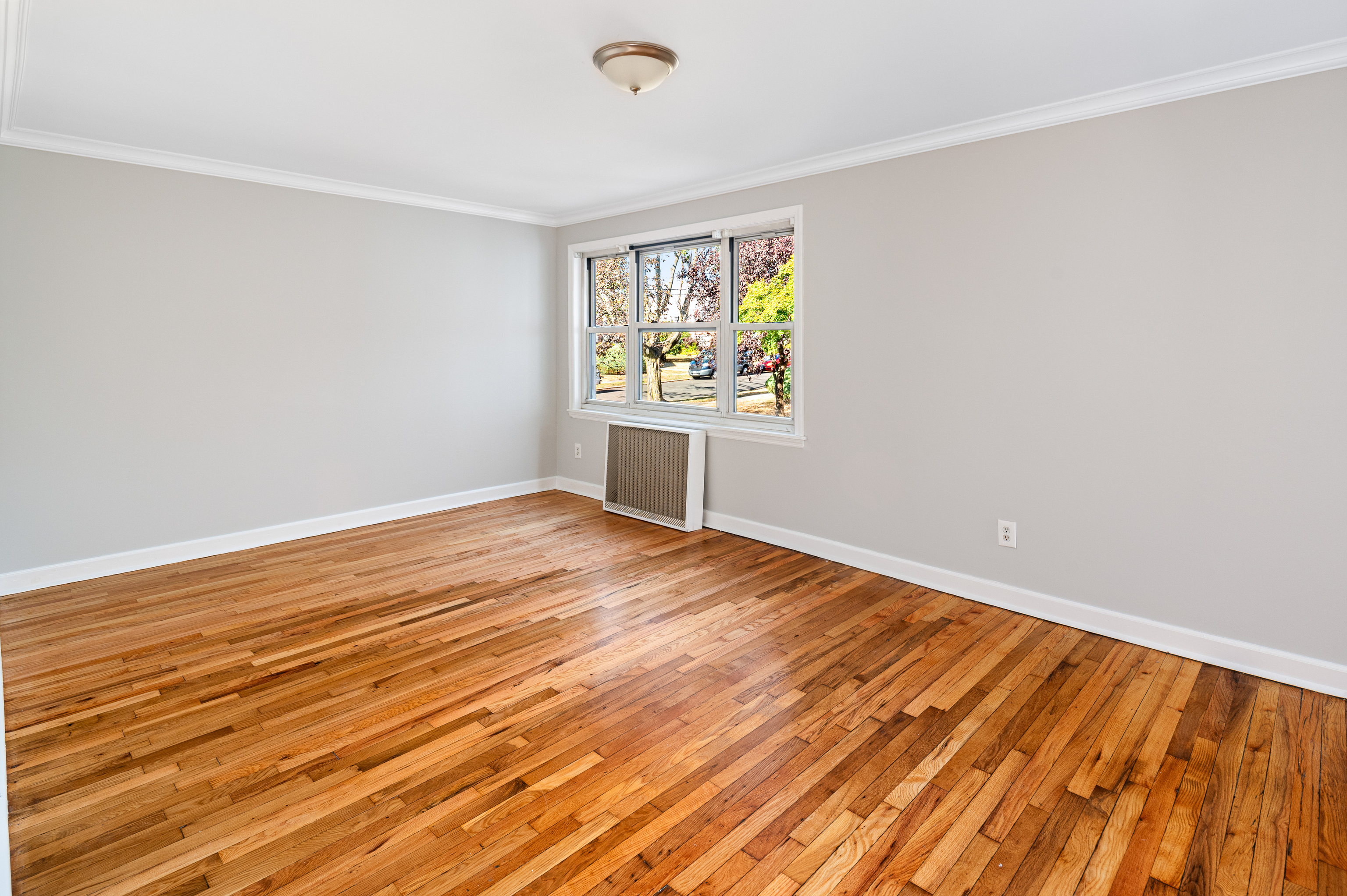 23 Standish Road, Unit 2 Stamford, CT 06902 - Photo 3 of 27 wooden floor in an empty room with a window