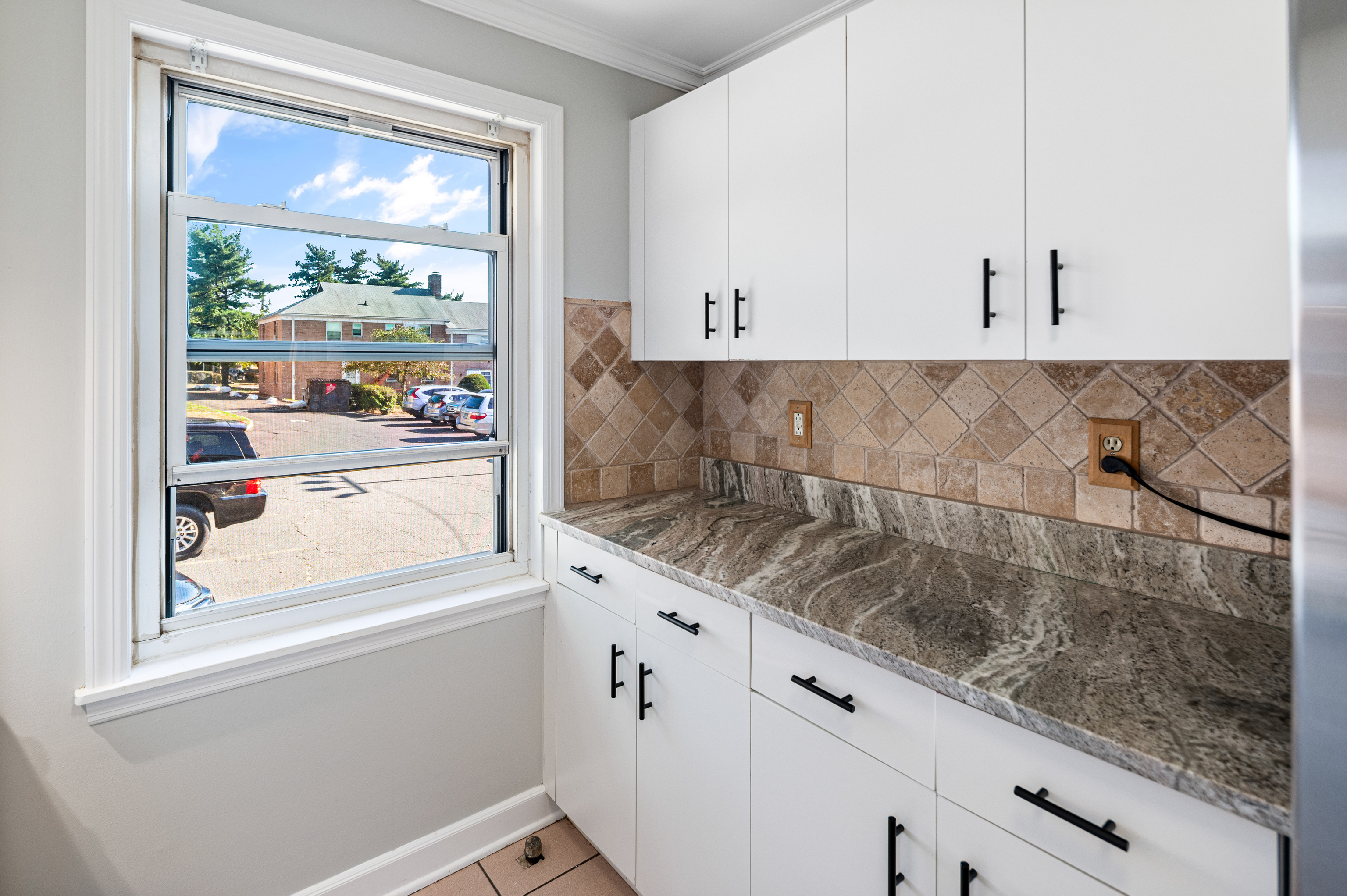 23 Standish Road, Unit 2 Stamford, CT 06902 - Photo 6 of 27 a kitchen with granite countertop a refrigerator and window