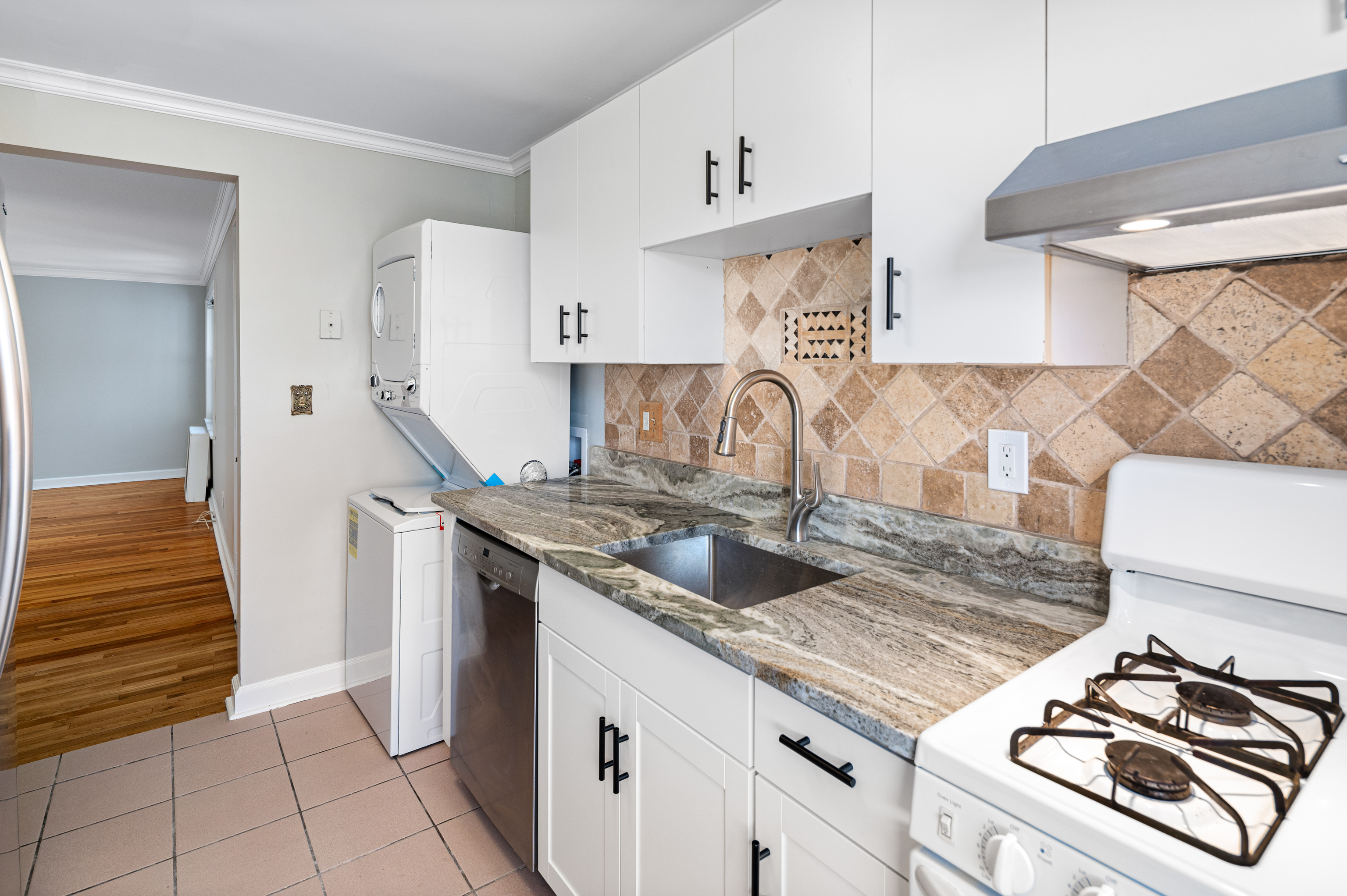 23 Standish Road, Unit 2 Stamford, CT 06902 - Photo 7 of 27 a kitchen with granite countertop a sink and a stove