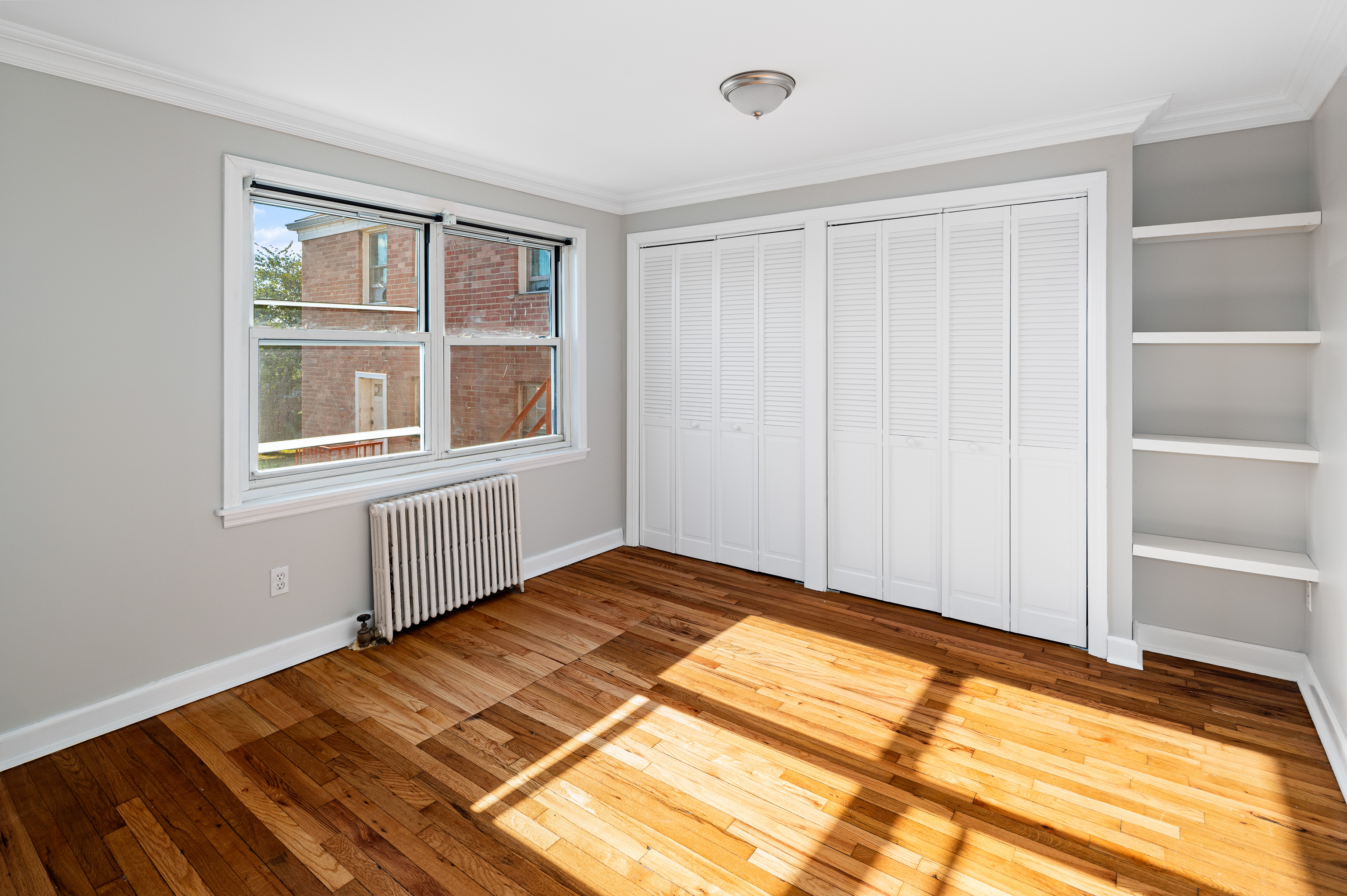 23 Standish Road, Unit 2 Stamford, CT 06902 - Photo 9 of 27 a view of a room with a wooden floor and a window