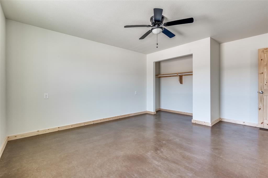 19161-19175 Cabo Way, Unit 19167 Thackerville, OK 73459 - Photo 15 of 25 a view of room with hardwood floor and a ceiling fan