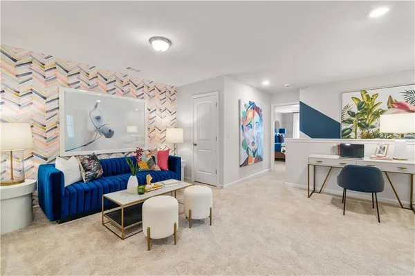 a living room with furniture and a rug