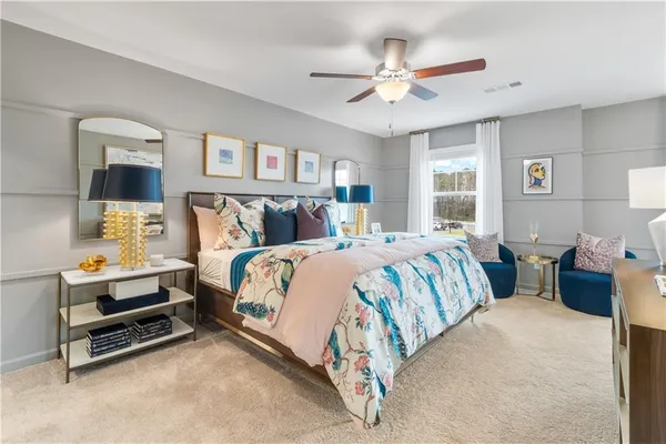 a bed room with a bed and a ceiling fan