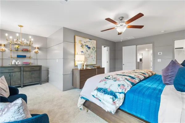 a bedroom with a bed dresser and a window