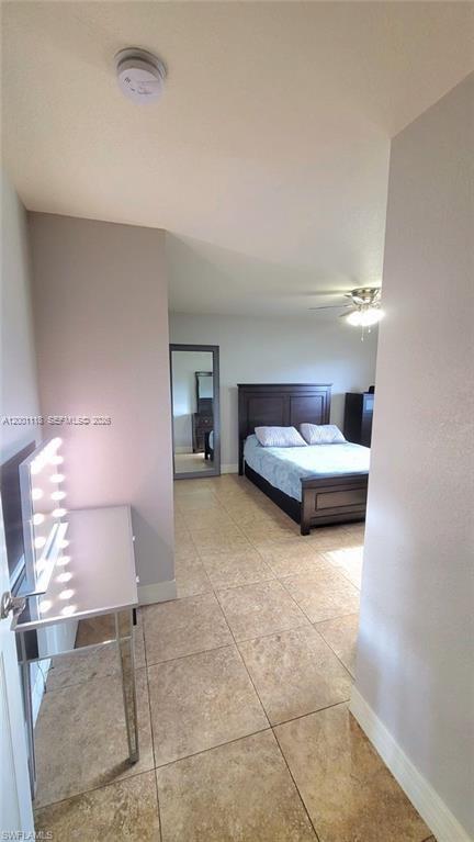 152 Pullman Street, Unit 152 Lehigh Acres, FL 33974 - Photo 12 of 15 a bedroom with furniture and window