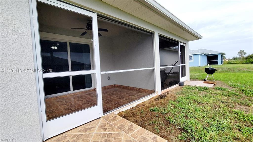 152 Pullman Street, Unit 152 Lehigh Acres, FL 33974 - Photo 14 of 15 a view of backyard with tub