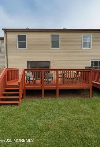 a view of a deck yard with a house