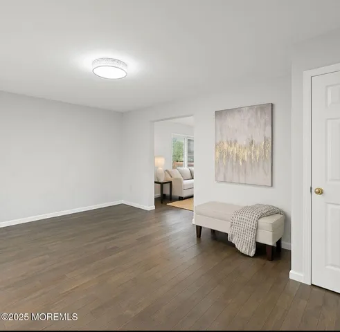 a view of livingroom with furniture and workspace