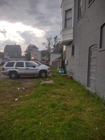 a view of a car in front of a building