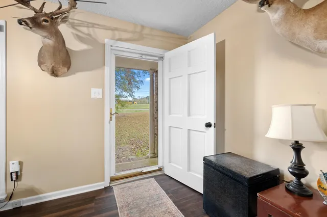 a view of a room with a mirror and a window