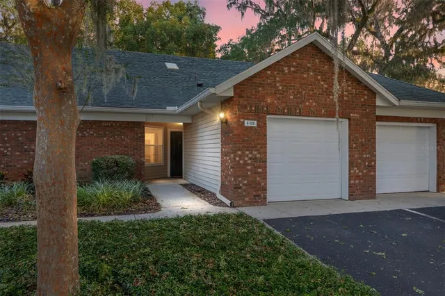 a view of a house with brick walls