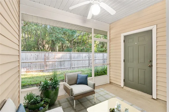 a backyard of a house with table and chairs