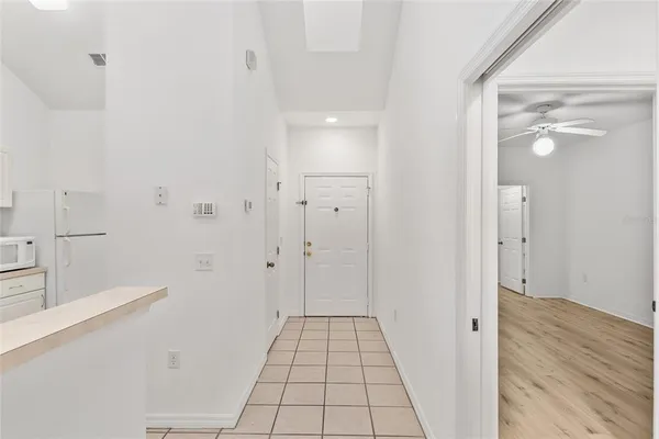 a utility room with cabinets washer and dryer