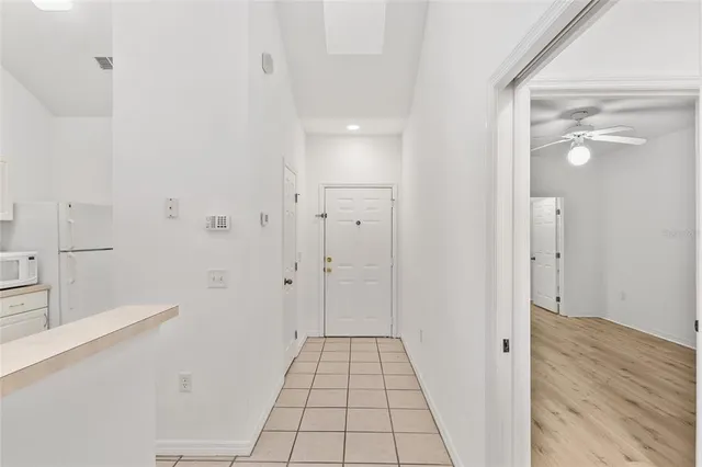 a utility room with cabinets washer and dryer