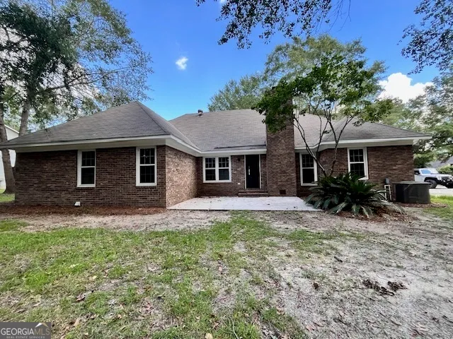 a front view of a house with a garden and porch