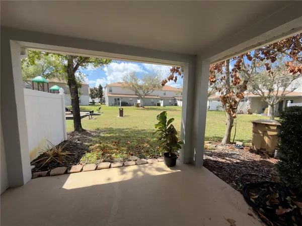 a view of a porch and garden