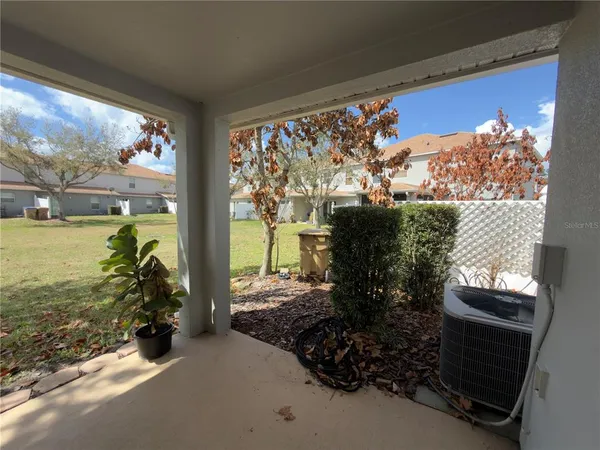 a picture of a floor to ceiling window and an outdoor view