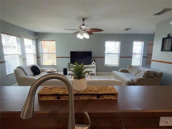 a living room with furniture and a large window