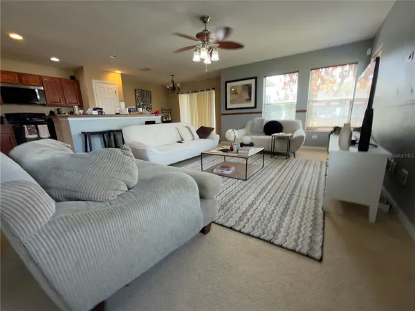 a living room with furniture and a large window