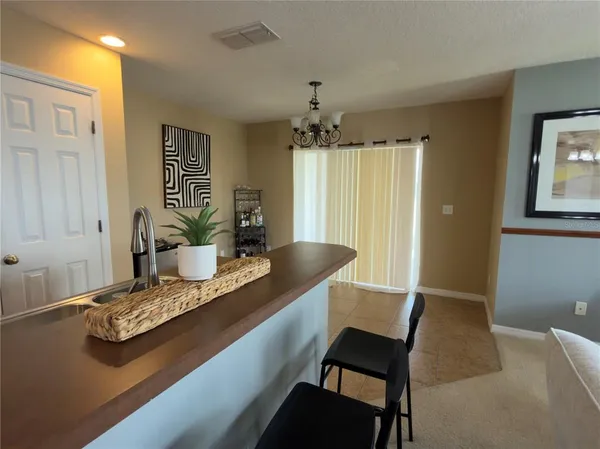 a dining room with a table and chairs