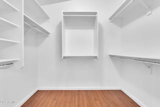 a view of an empty walk in closet