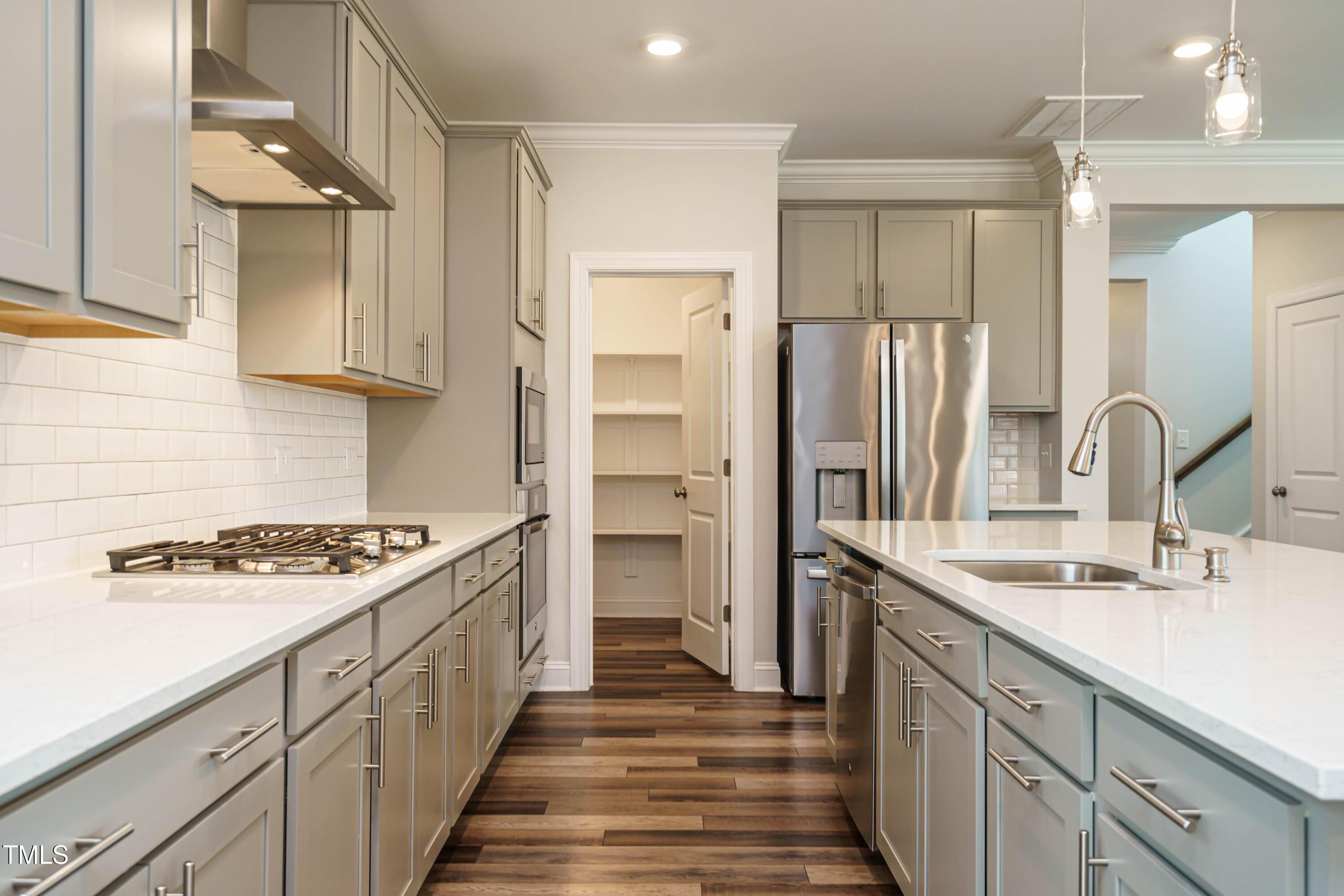 5201 Influence Way Raleigh, NC 27616 - Photo 16 of 33 a kitchen with stainless steel appliances granite countertop a sink stove and refrigerator