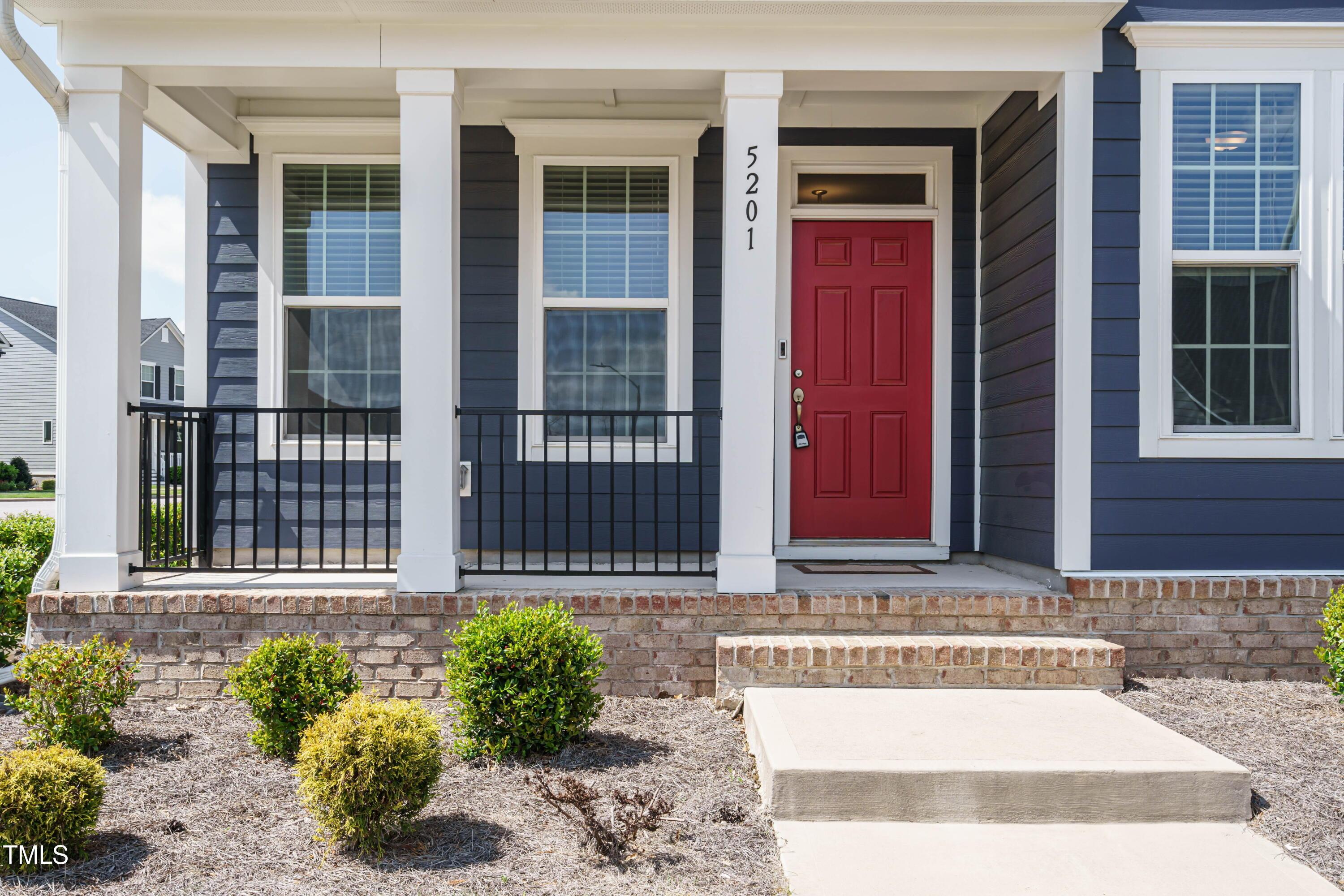 5201 Influence Way Raleigh, NC 27616 - Photo 2 of 33 a front view of a house with a yard