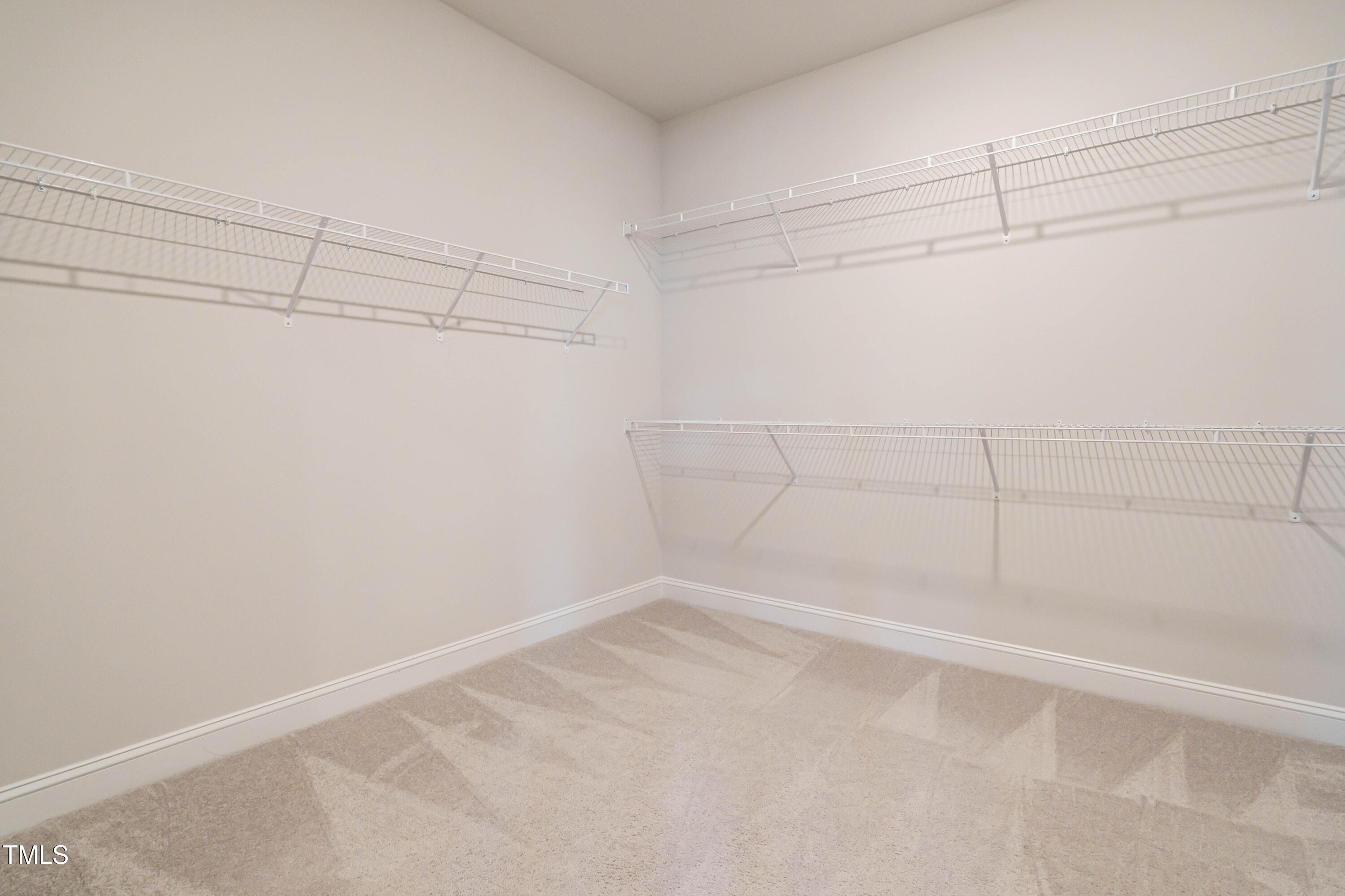 5201 Influence Way Raleigh, NC 27616 - Photo 24 of 33 a view of a room with racks on the wall