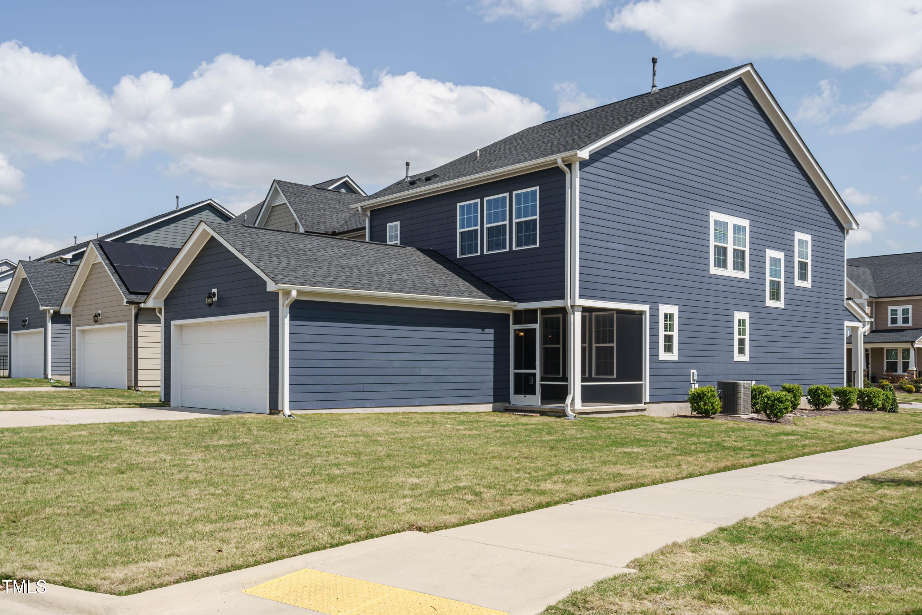 5201 Influence Way Raleigh, NC 27616 - Photo 32 of 33 a front view of a house with garden