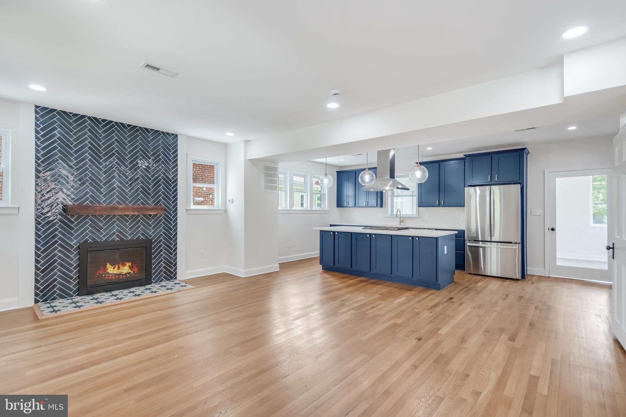6932 8th Street Northwest Washington, DC 20012 - Photo 14 of 43 a view of kitchen with wooden floor and a fireplace
