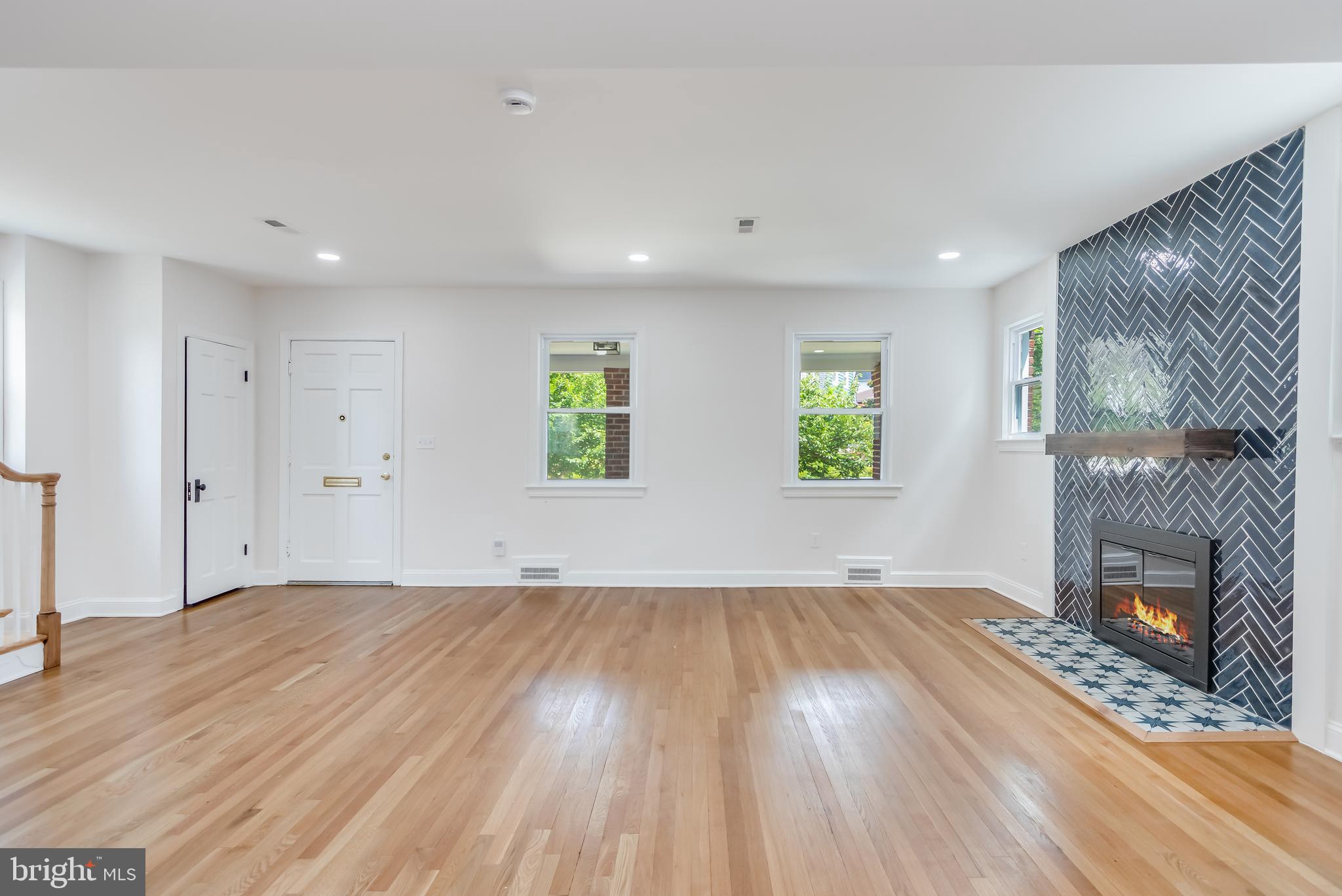 6932 8th Street Northwest Washington, DC 20012 - Photo 16 of 43 an empty room with windows and fireplace