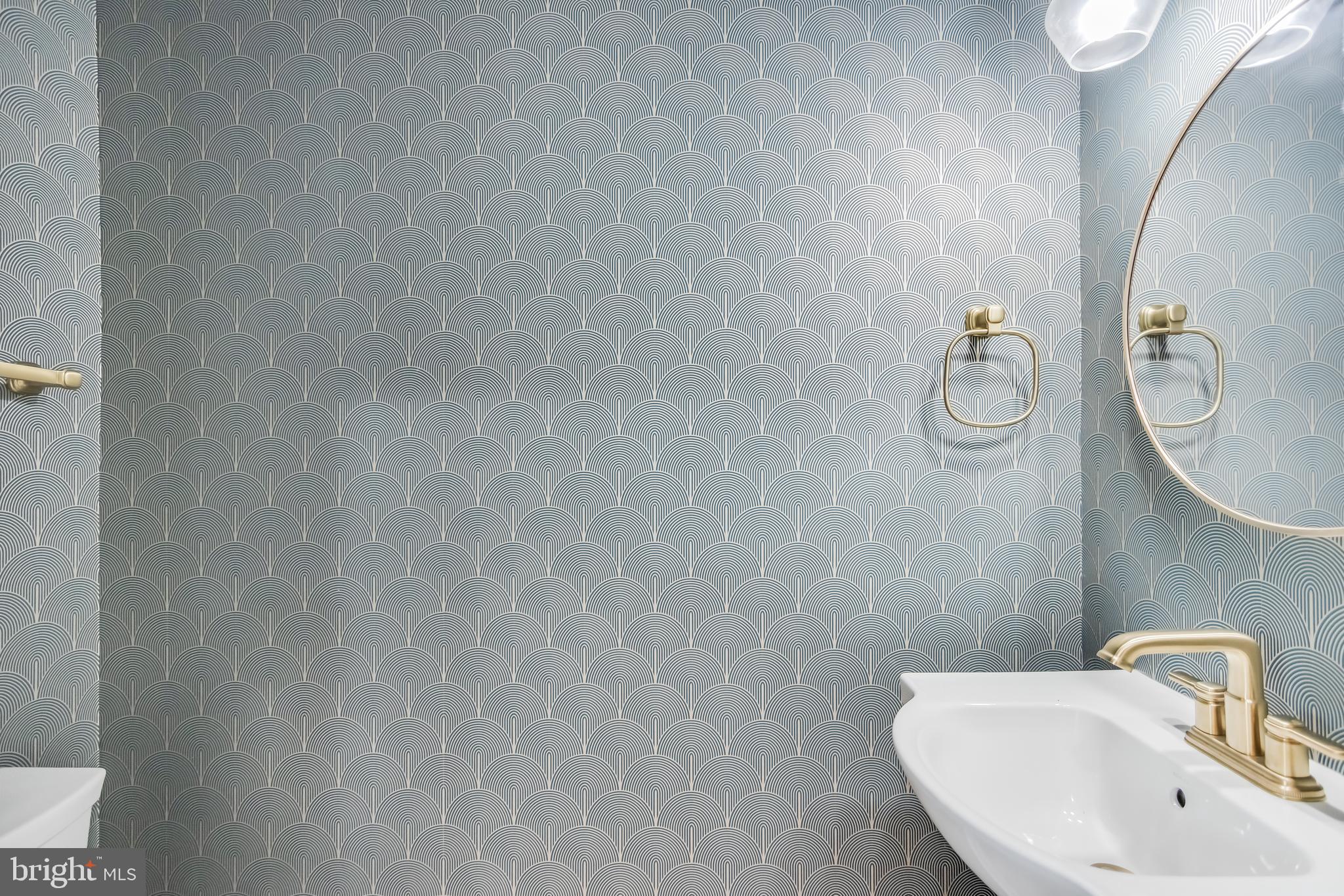 6932 8th Street Northwest Washington, DC 20012 - Photo 17 of 43 a bathroom with a sink and mirror