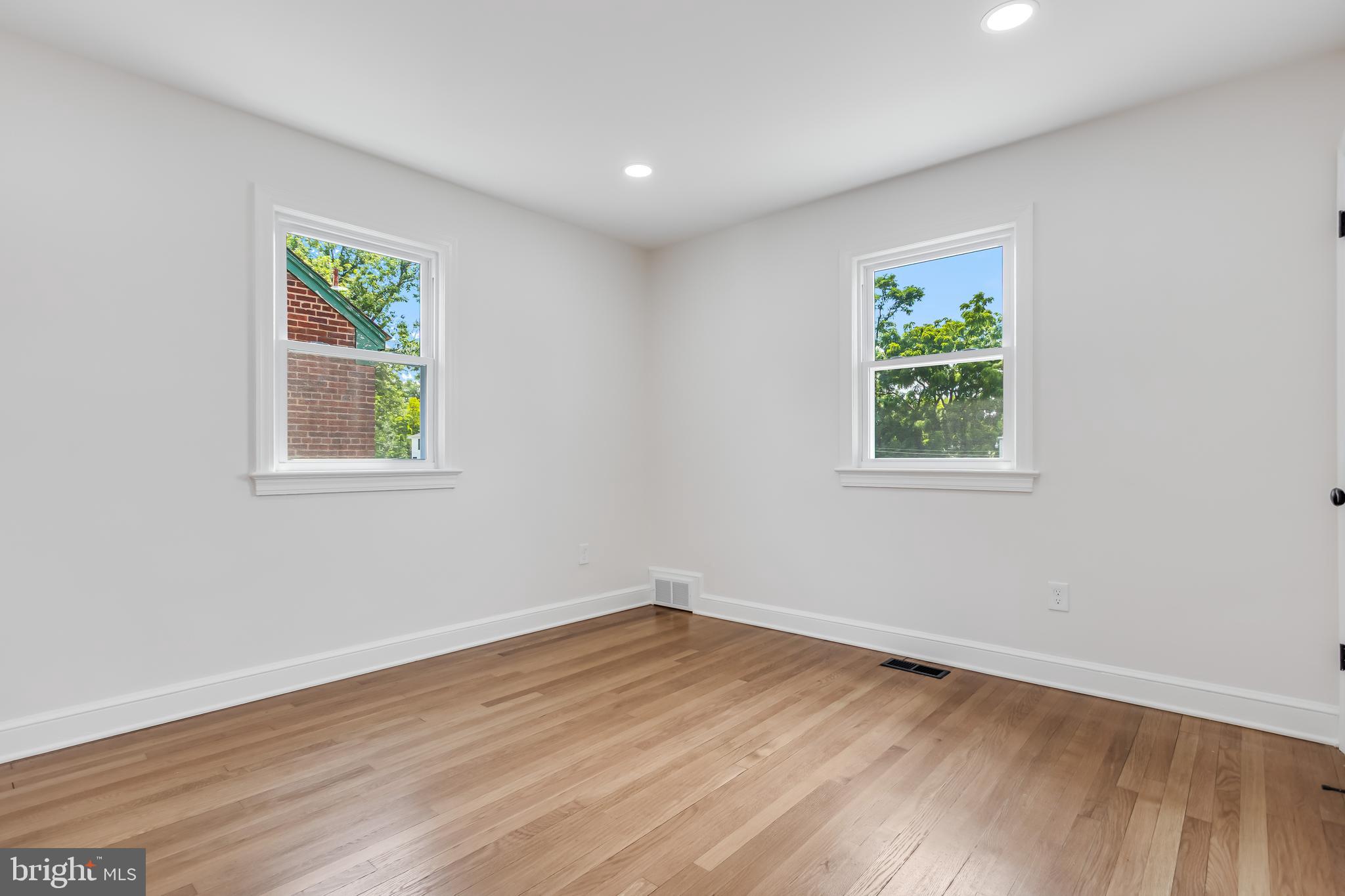 6932 8th Street Northwest Washington, DC 20012 - Photo 27 of 43 wooden floor in an empty room with a window