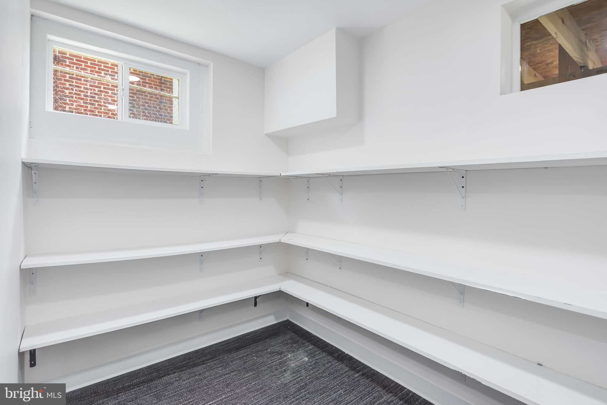 6932 8th Street Northwest Washington, DC 20012 - Photo 38 of 43 a storage room with washer and dryer
