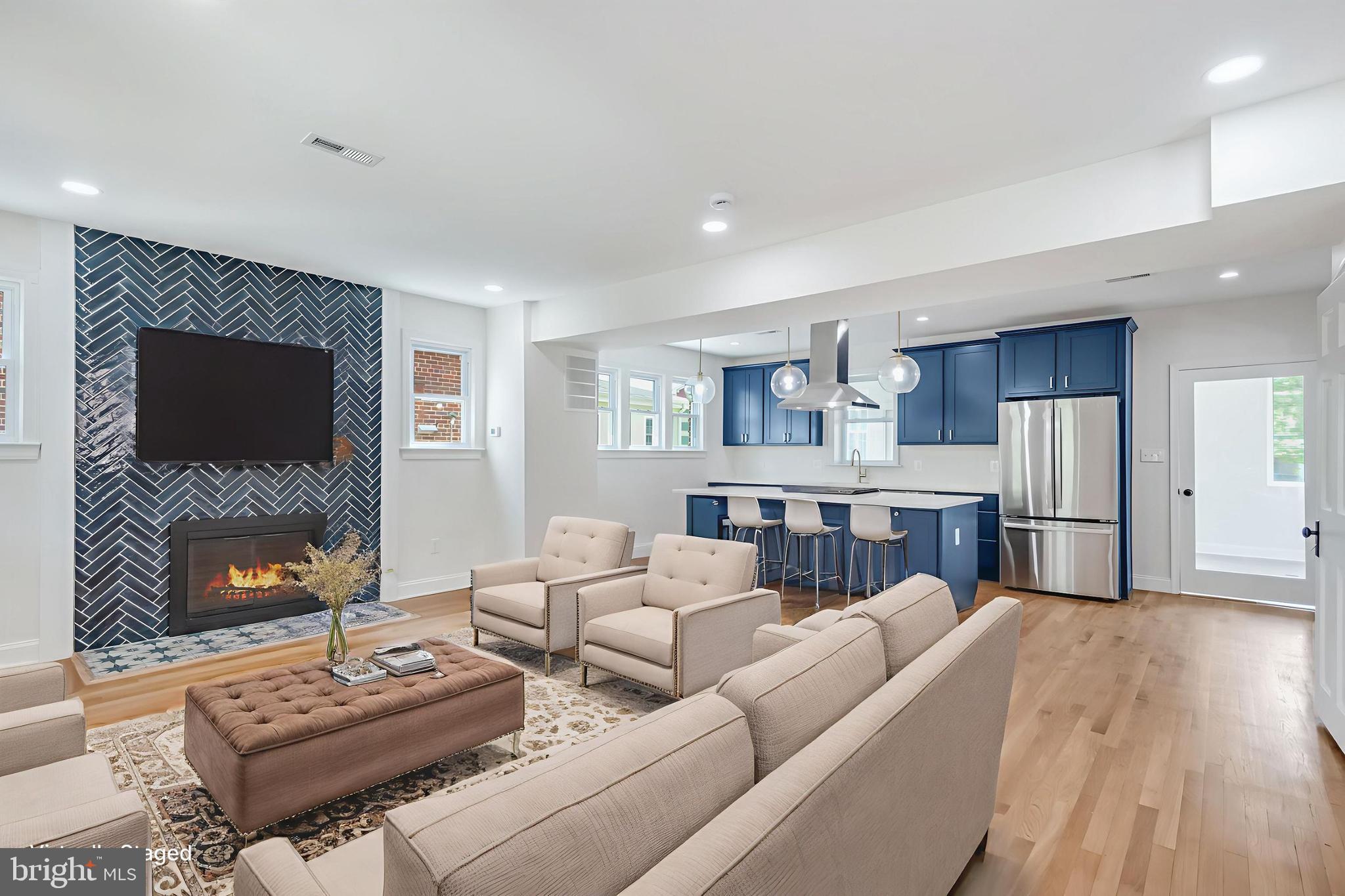 6932 8th Street Northwest Washington, DC 20012 - Photo 4 of 43 a living room with furniture and a flat screen tv
