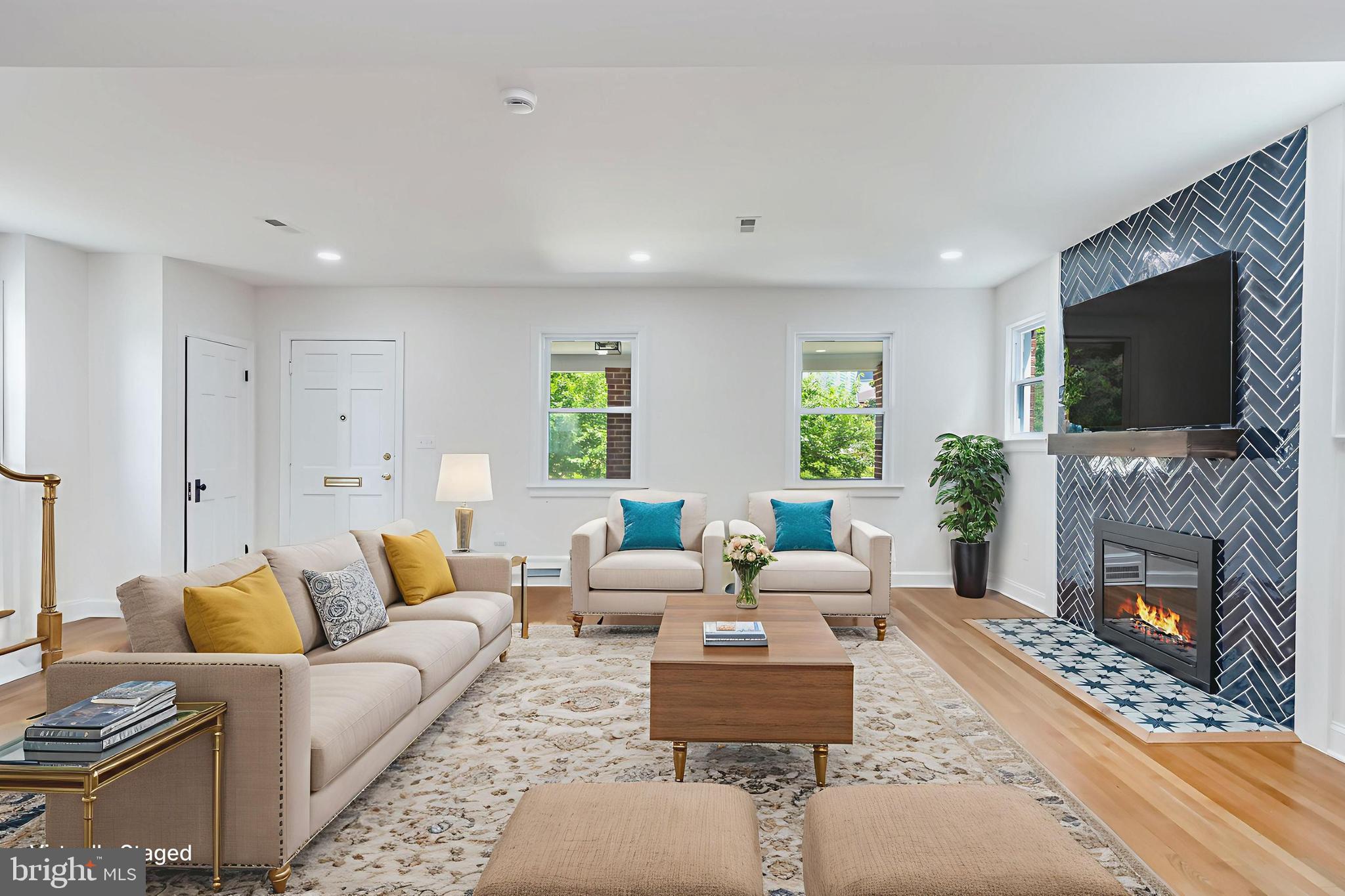 6932 8th Street Northwest Washington, DC 20012 - Photo 5 of 43 a living room with furniture a fireplace and a flat screen tv